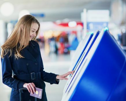 women using kiosk at public place